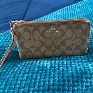 Coach wrist wallet. Fits phone, credit cards, money, sunglasses.